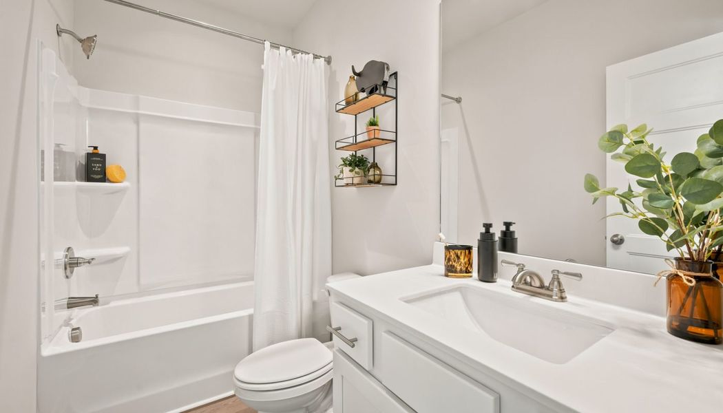 Furnished interior in a model home at Fowler Farms in Auburn (Image 138).