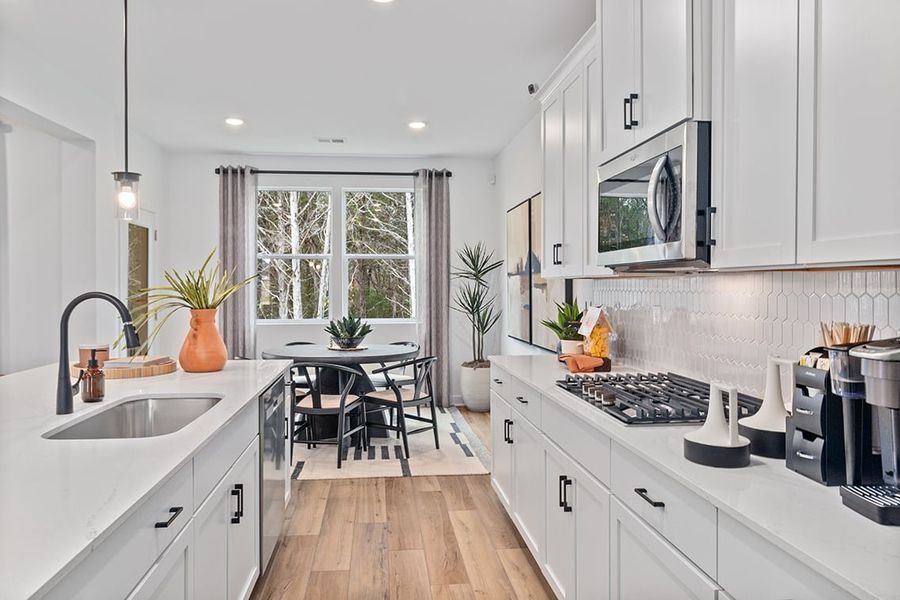 A kitchen with white cabinets. A kitchen with white cabinets.