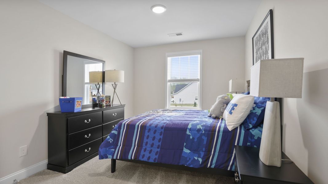 Furnished interior in a model home at Blue Ridge Trail in Fountain Inn (Image 19).