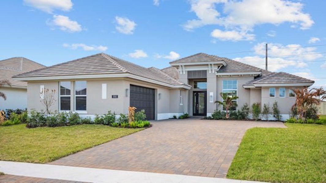 Front exterior of a home in the Bent Pine Preserve community, located in Vero Beach, FL (Image 54).