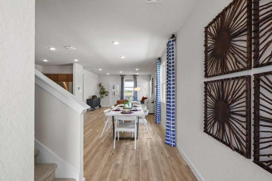 A room with a table and chairs.