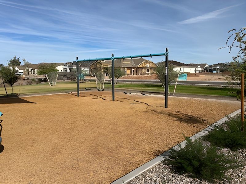 A vibrant neighborhood with a scenic view, showcasing a playground in Edgewood Estates by K. Hovnanian® Homes (Queen Creek, AZ).