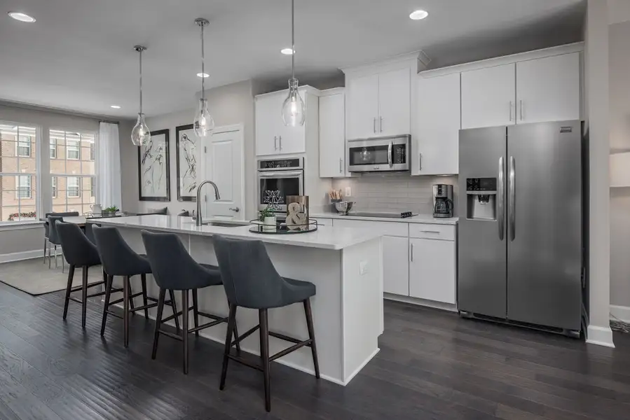 Modern kitchen with stainless steel appliances and ample counter space Modern kitchen with stainless steel appliances and ample counter space