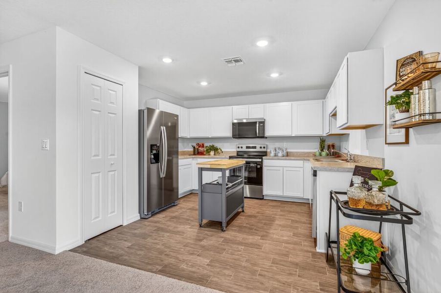 Furnished interior in a model home at Mallard Landing in Okeechobee (Image 7).