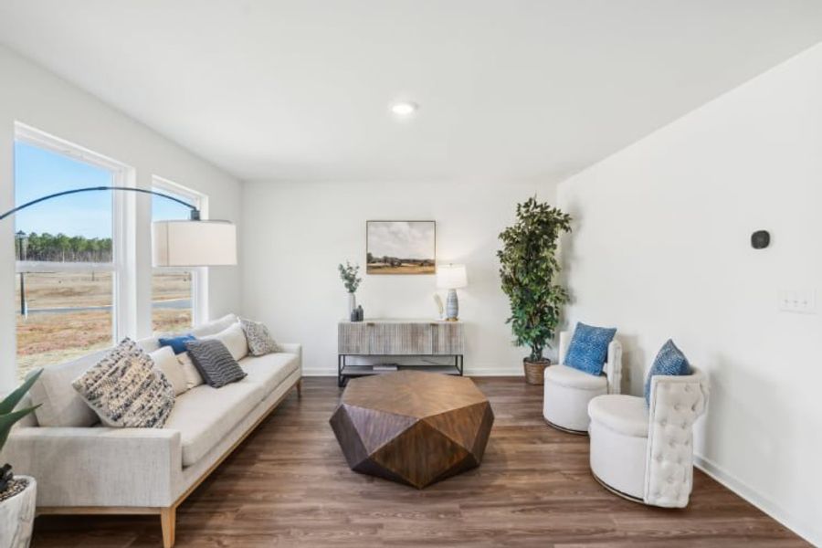 A living room with a large glass door. A living room with a large glass door.