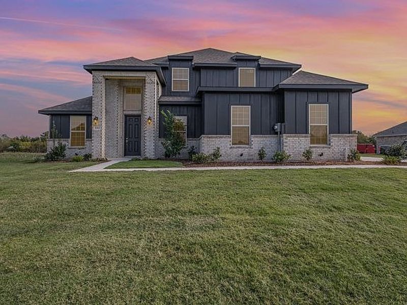 Front exterior of a home in the Crystal Lake Estates community, located in Red Oak, TX (Image 2). Front exterior of a home in the Crystal Lake Estates community, located in Red Oak, TX (Image 2).