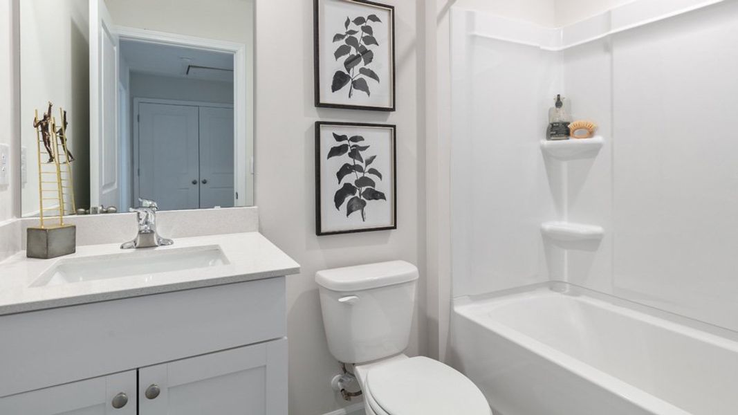 Furnished interior in a model home at The Townes at Matthews Landing in Fuquay Varina (Image 15).