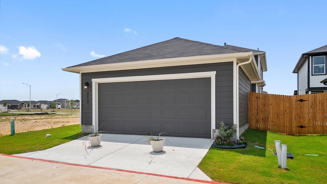 Front exterior of a home in the Valverde community, located in Bastrop, TX (Image 9). Front exterior of a home in the Valverde community, located in Bastrop, TX (Image 9).