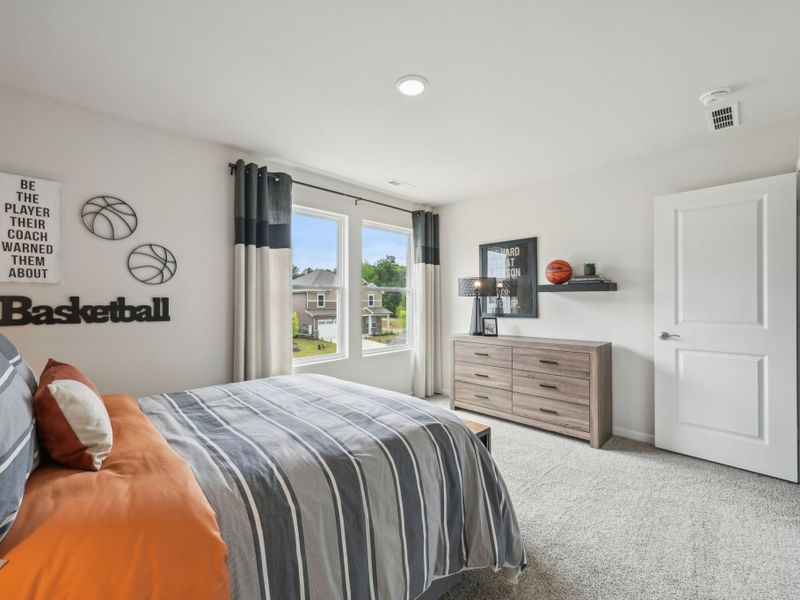 Three secondary bedrooms surround the upstairs loft.