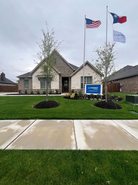 A charming brick home with lush landscaping in The Meadows by Landsea Homes (Gunter, TX). A charming brick home with lush landscaping in The Meadows by Landsea Homes (Gunter, TX).