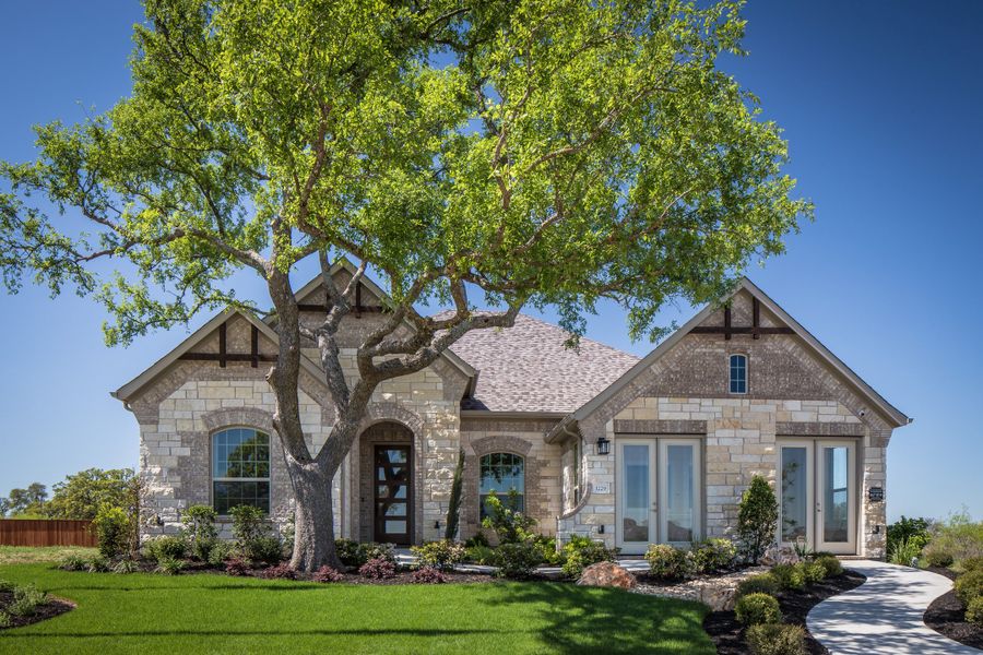 Front exterior of a home in the Oaks at San Gabriel community, located in Georgetown, TX (Image 6).