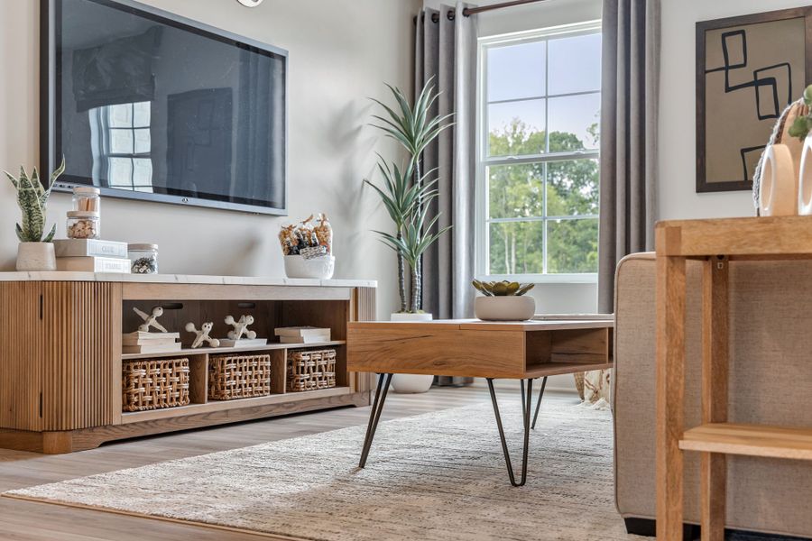 A room with a table and chairs.