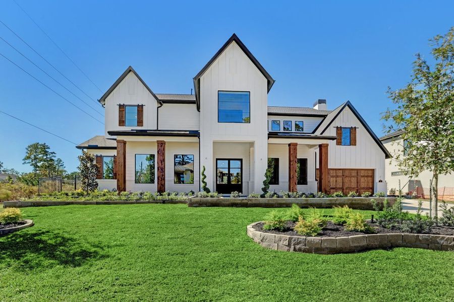 Front exterior of a home in the Carlton Woods Village of Creekside Park community, located in The Woodlands, TX (Image 6). Front exterior of a home in the Carlton Woods Village of Creekside Park community, located in The Woodlands, TX (Image 6).
