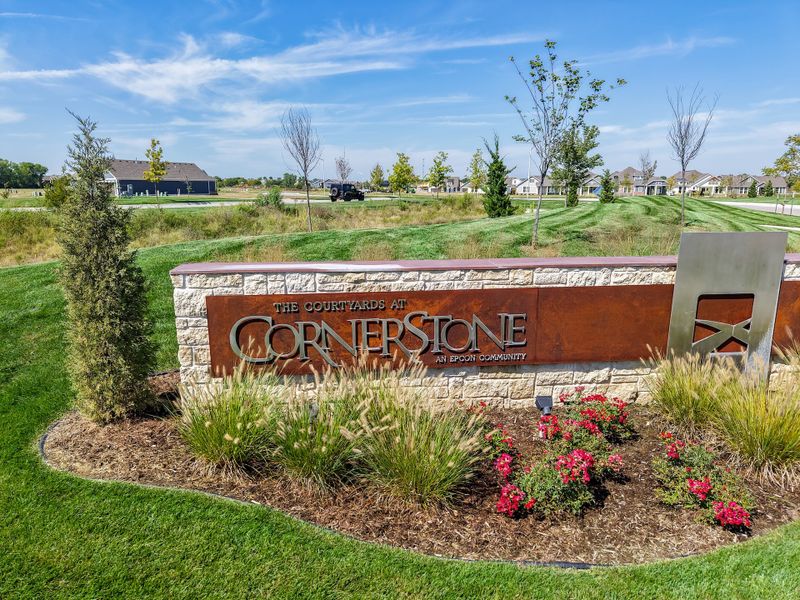 Entrance to the The Courtyards at Cornerstone community in Andover, KS, featuring signage and landscaping (Image 2).