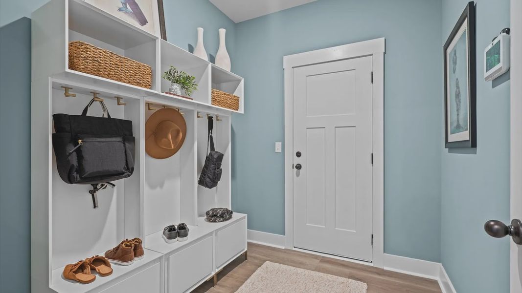 Garage entry mudroom with hardwood flooring at Pinebrook by DRB Homes in Woodruff, SC Garage entry mudroom with hardwood flooring at Pinebrook by DRB Homes in Woodruff, SC