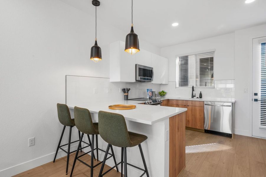 Furnished interior in a model home at Sloan's View Townhomes in Denver (Image 11). Furnished interior in a model home at Sloan's View Townhomes in Denver (Image 11).