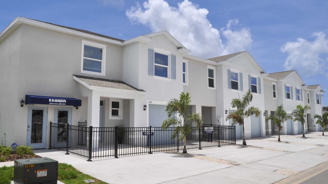 Front exterior of a home in the Oasis at Longwood Run community, located in Sarasota, FL (Image 1).