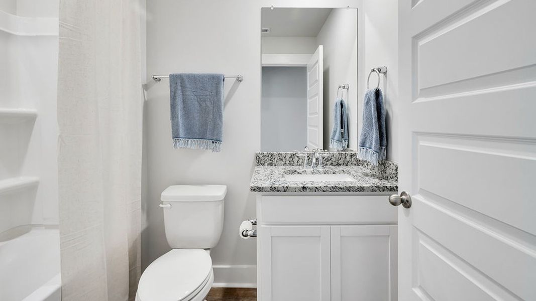 Furnished interior in a model home at Cedar Hill Landing in Navassa (Image 24).