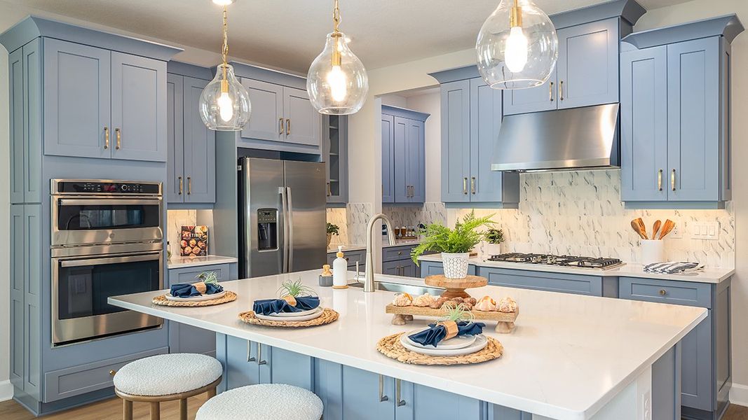 Furnished interior in a model home at Ardisia Park in New Smyrna Beach (Image 5).