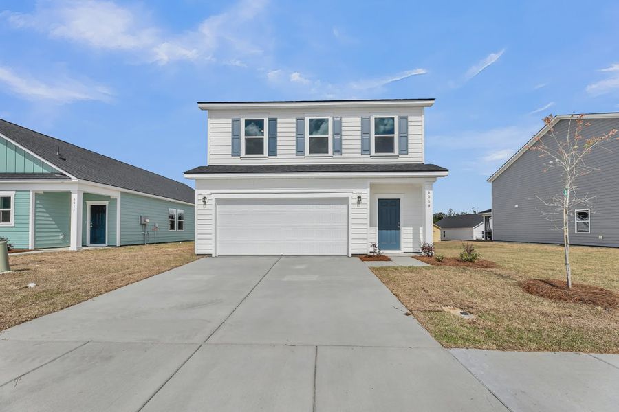 Front exterior of a home in the Tea Farm community, located in Ravenel, SC (Image 10).