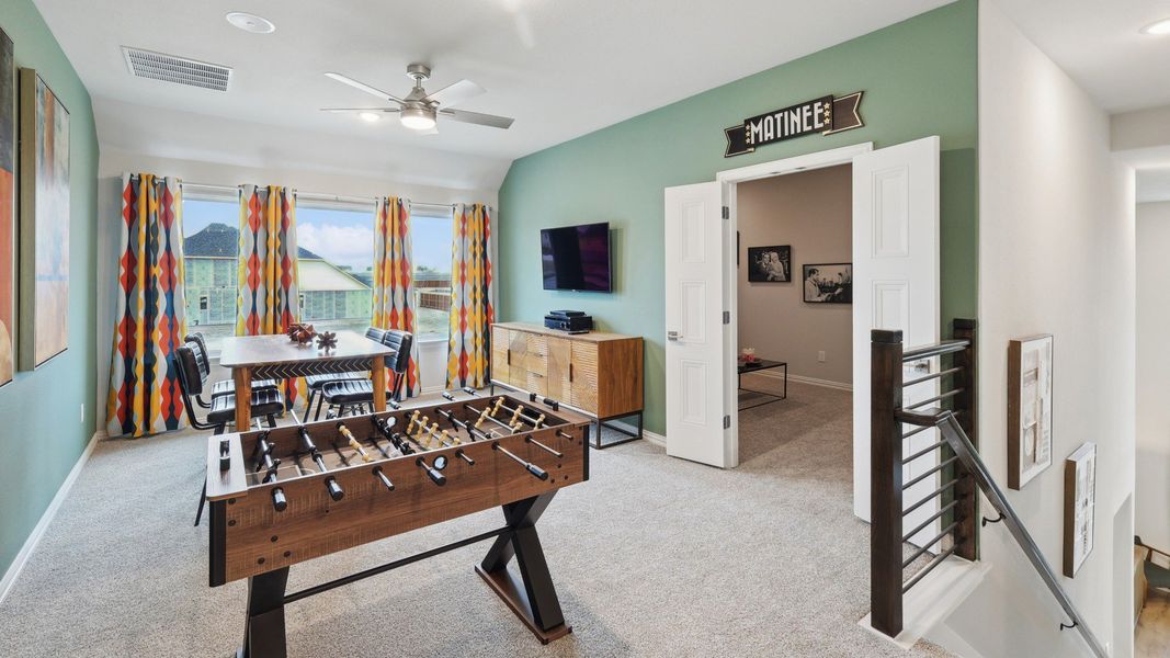 Upstairs Game Room with foosball and activity area in DRB Homes Magnolia plan
