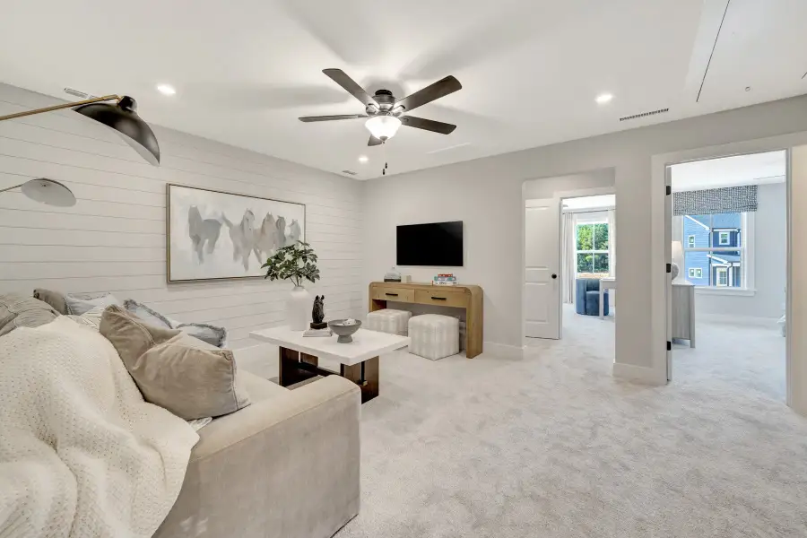 Furnished interior in a model home at Friendship Village Townhomes in Apex (Image 9).
