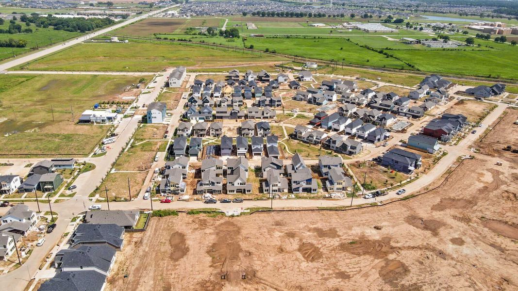 Aerial view of the Indigo: 40ft. lots community in Richmond, TX, showing layout and nearby surroundings (Image 16). Aerial view of the Indigo: 40ft. lots community in Richmond, TX, showing layout and nearby surroundings (Image 16).