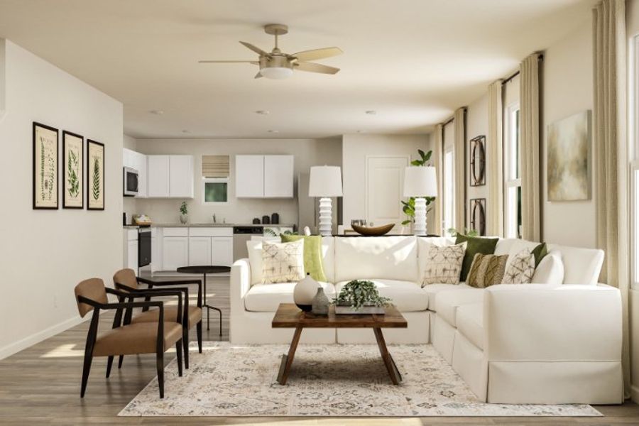 A living room with a white couch. A living room with a white couch.