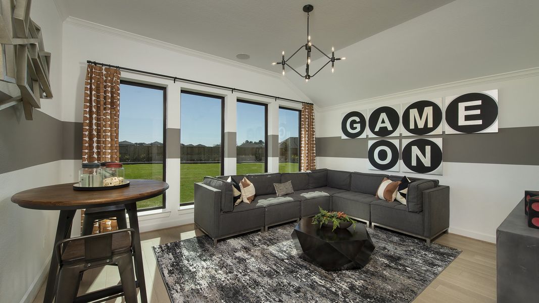 Furnished interior in a model home at Cane Island 80' in Katy (Image 17).