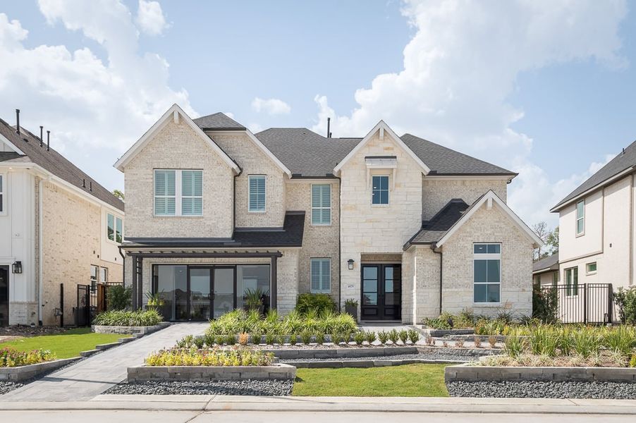 Front exterior of a home in the Sienna 60’ community, located in Missouri City, TX (Image 4).