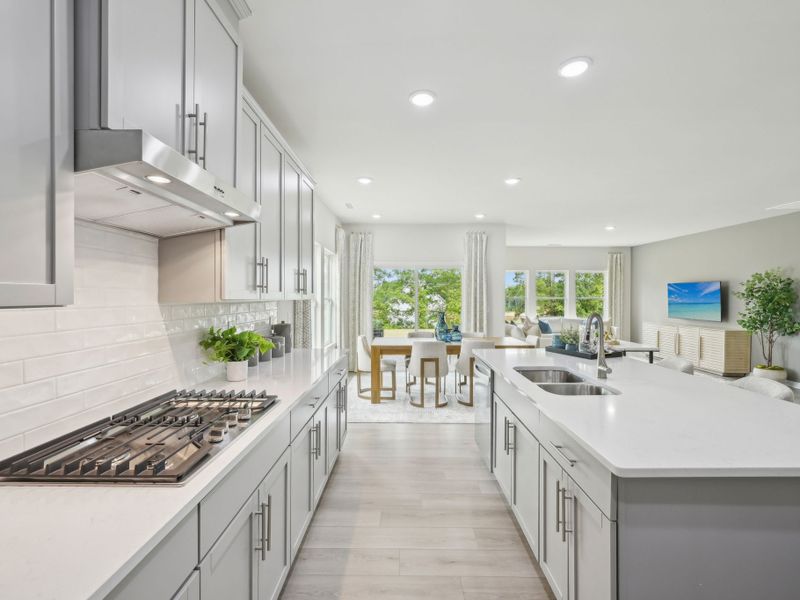 The spacious kitchen features a walk-in pantry, fit for a home chef.