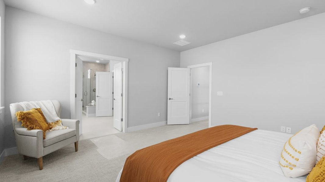 Luxurious bedroom features textured carpet and contemporary accents in prestigious Montaine location.