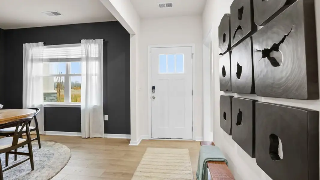 Furnished interior in a model home at Benjamin's Grove in Woodruff (Image 6).