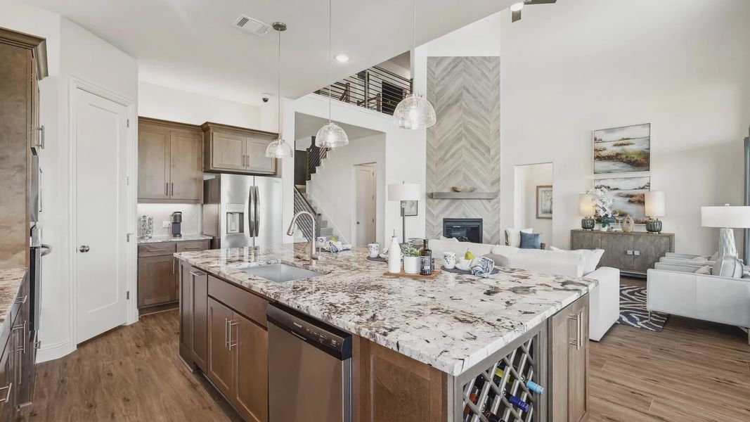 Elegant marble island and premium wood flooring define this Ridge Crossing kitchen space. Elegant marble island and premium wood flooring define this Ridge Crossing kitchen space.