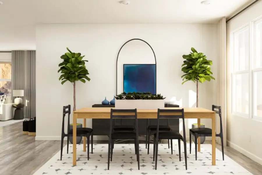 A dining room table with chairs and a large window.