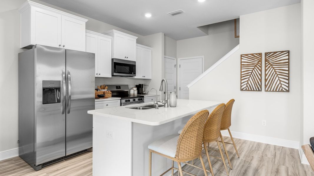 Furnished interior in a model home at WindMark Townhomes in Port Saint Joe (Image 17).