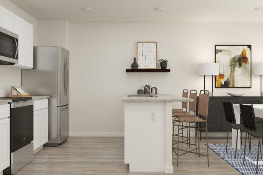 A kitchen with a table and chairs.