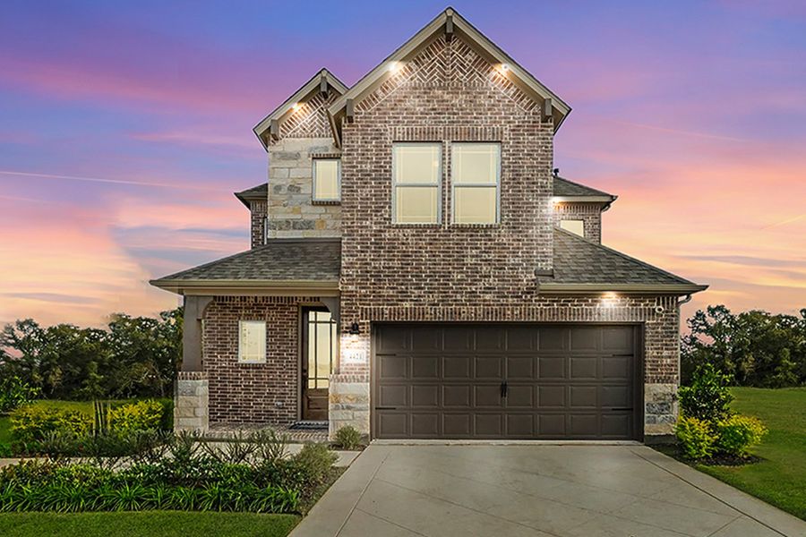 Front exterior of a home in the The Reserve at Spiritas Ranch community, located in Little Elm, TX (Image 2).
