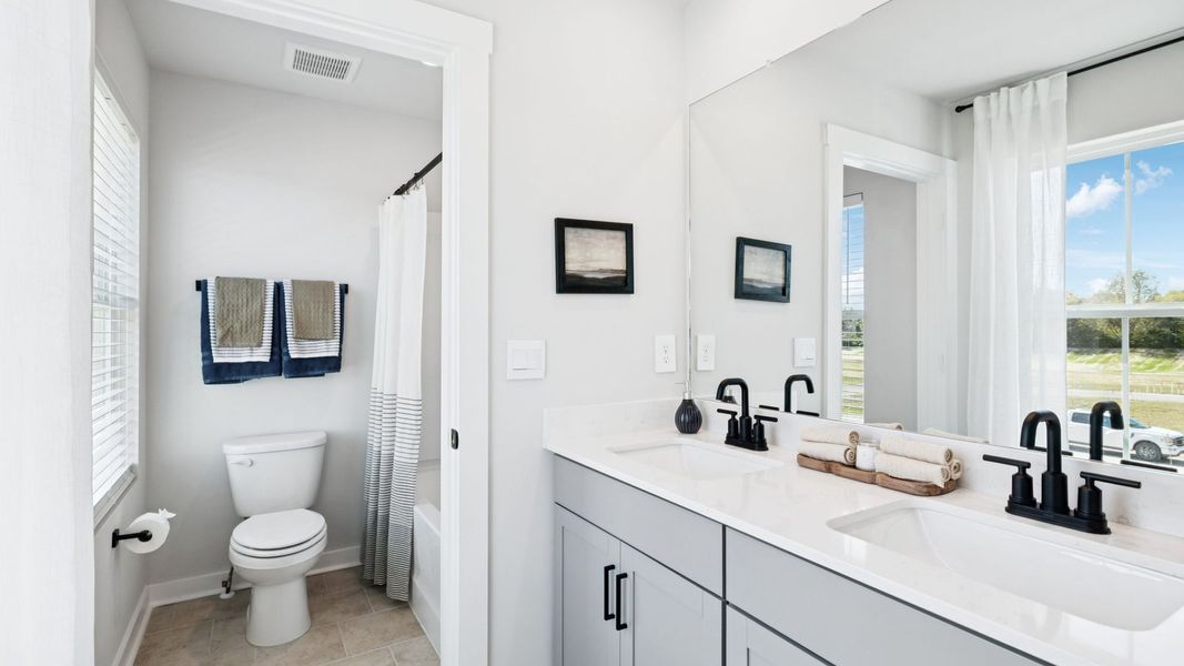 Furnished interior in a model home at Harvest Point in Spring Hill (Image 79).