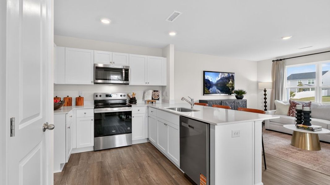 Furnished interior in a model home at The Townes at Wilson's Ridge in Wilson's Mills (Image 11). Furnished interior in a model home at The Townes at Wilson's Ridge in Wilson's Mills (Image 11).