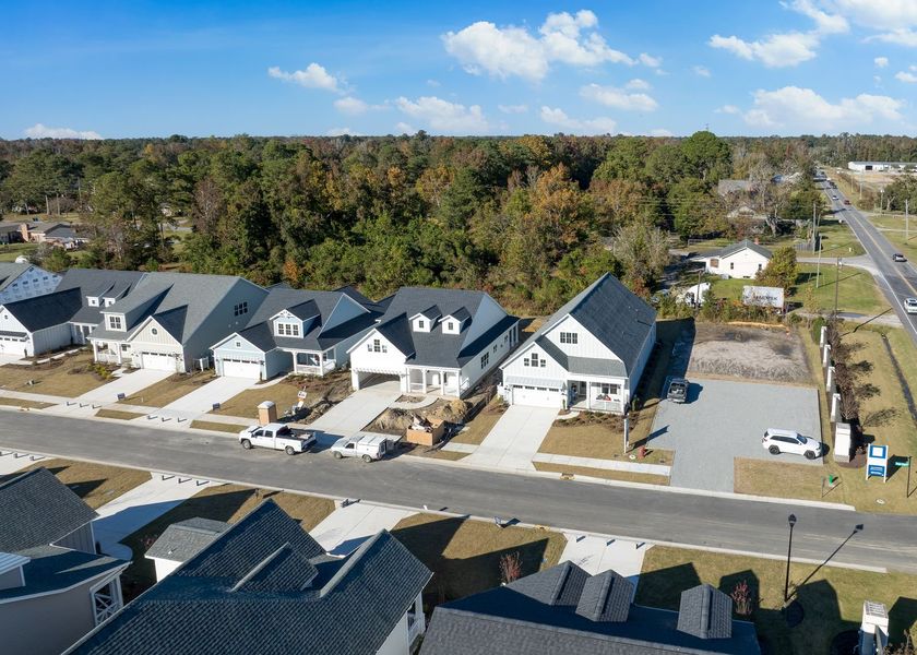 Aerial view of the Riverside Cove community in Wilmington, NC, showing layout and nearby surroundings (Image 1). Aerial view of the Riverside Cove community in Wilmington, NC, showing layout and nearby surroundings (Image 1).