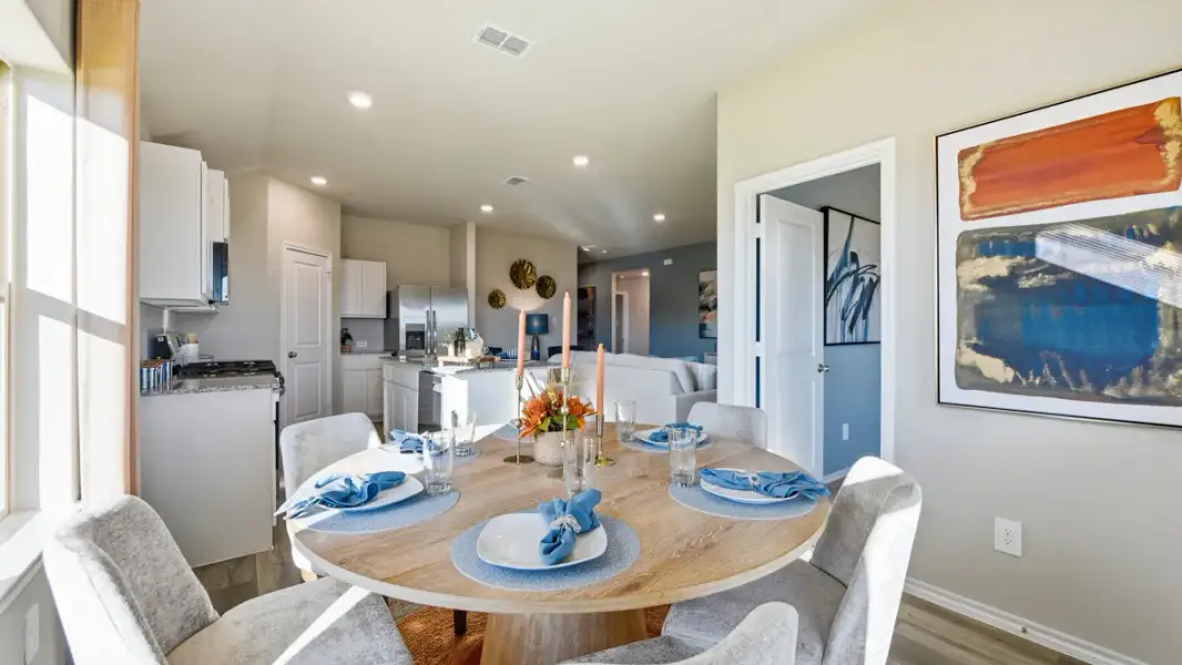 Furnished interior in a model home at Webster Meadows in Ponder (Image 7).