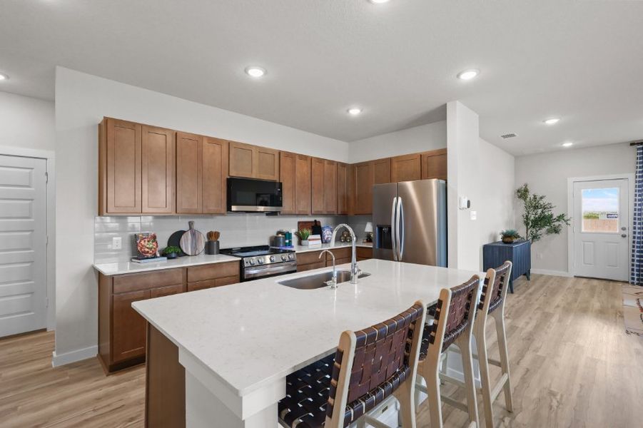A kitchen with a dining table.