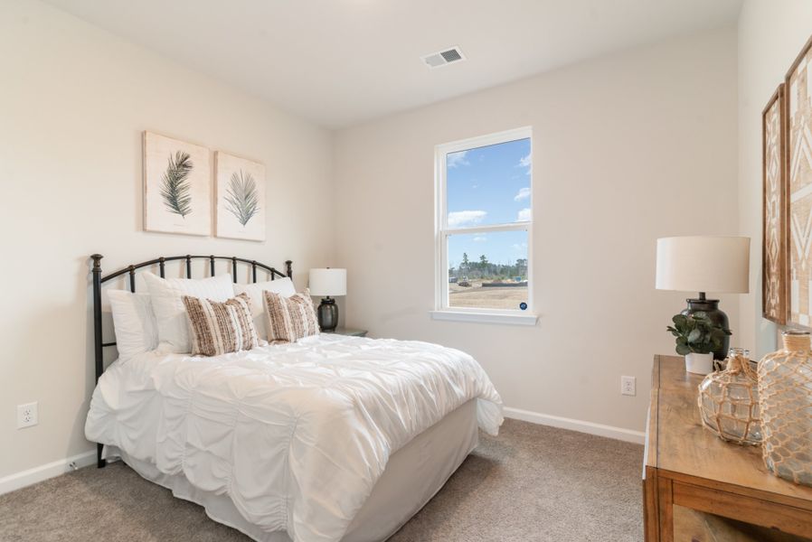Furnished interior in a model home at Kingston Bay in Conway (Image 16).