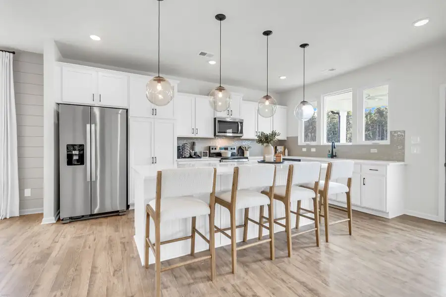 Furnished interior in a model home at Reeves Crossing in St. George (Image 2).
