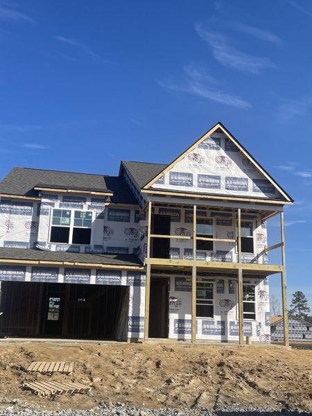 Under-construction home in Berkeley Bay by D.R. Horton, Ridgeville, SC, featuring a two-story design and spacious layout.