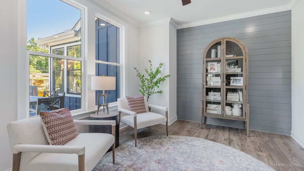 Furnished interior in a model home at The Courtyards at Redbud Lane in Holly Springs (Image 24).