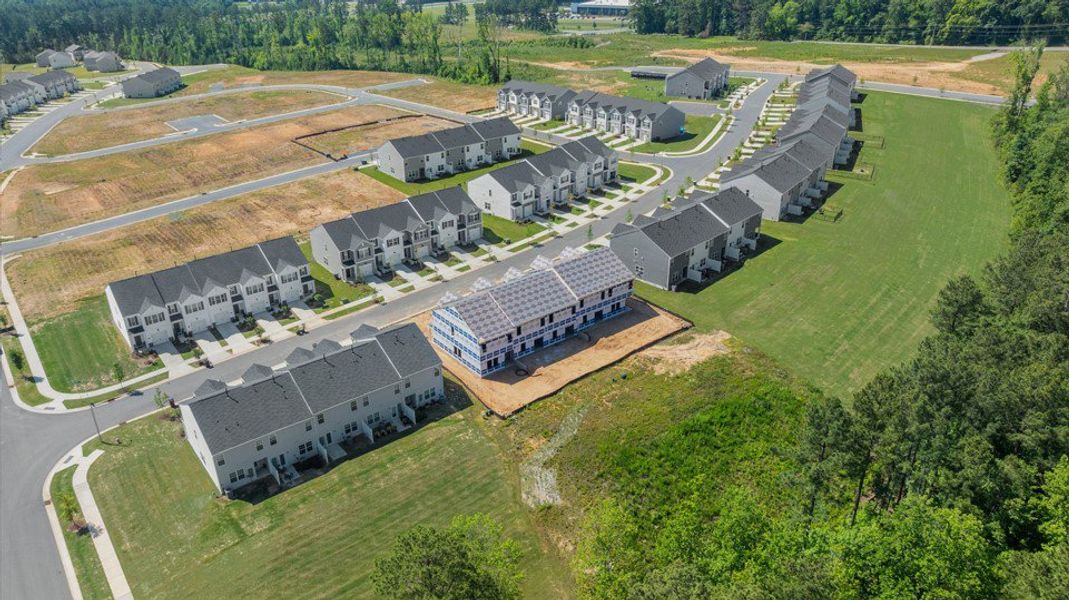 Aerial view of the The Townes at Galvins Ridge community in Sanford, NC, showing layout and nearby surroundings (Image 14). Aerial view of the The Townes at Galvins Ridge community in Sanford, NC, showing layout and nearby surroundings (Image 14).