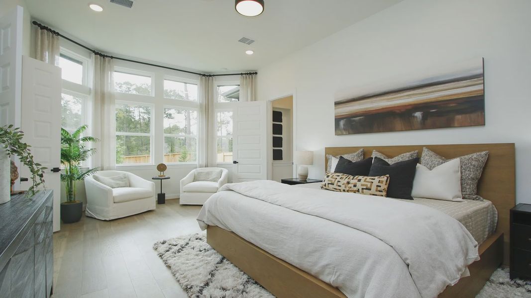 Discover expansive bay windows and sophisticated decor in this Woodlands Hills sanctuary.