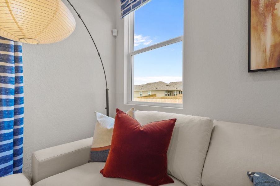 A couch with pillows.